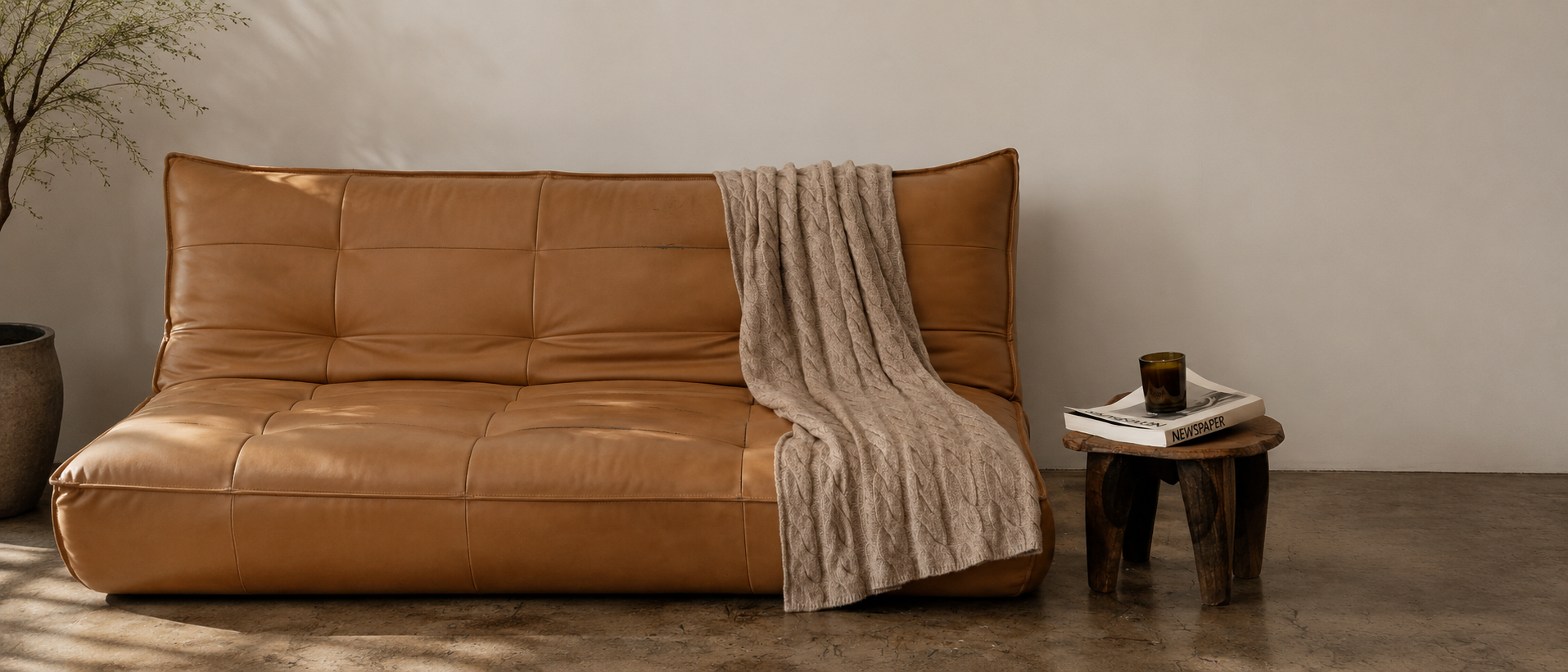Cushions and throws arranged in a warm interior